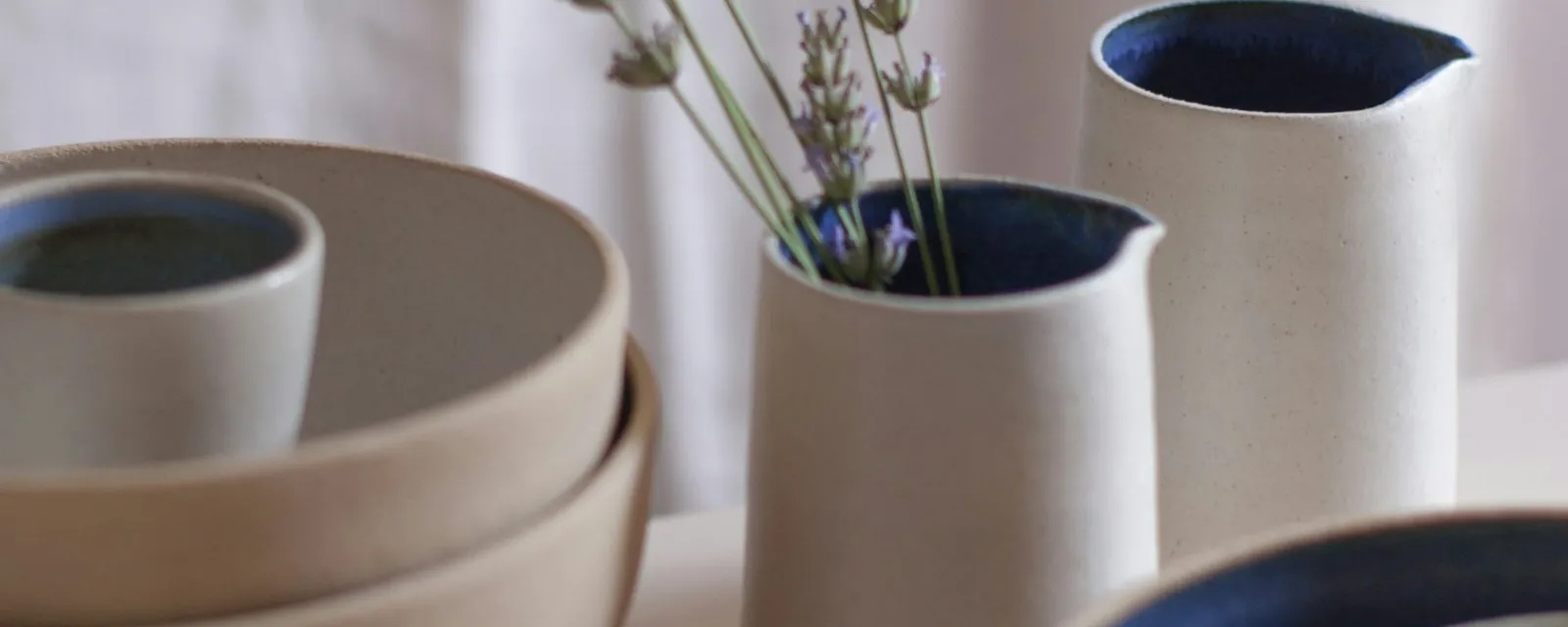Handmade ceramics arranged on a table