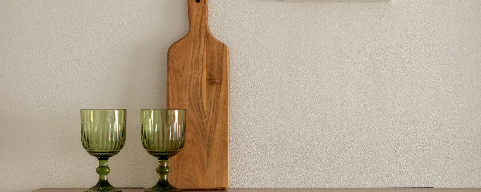 A styled kitchen scene with wooden boards