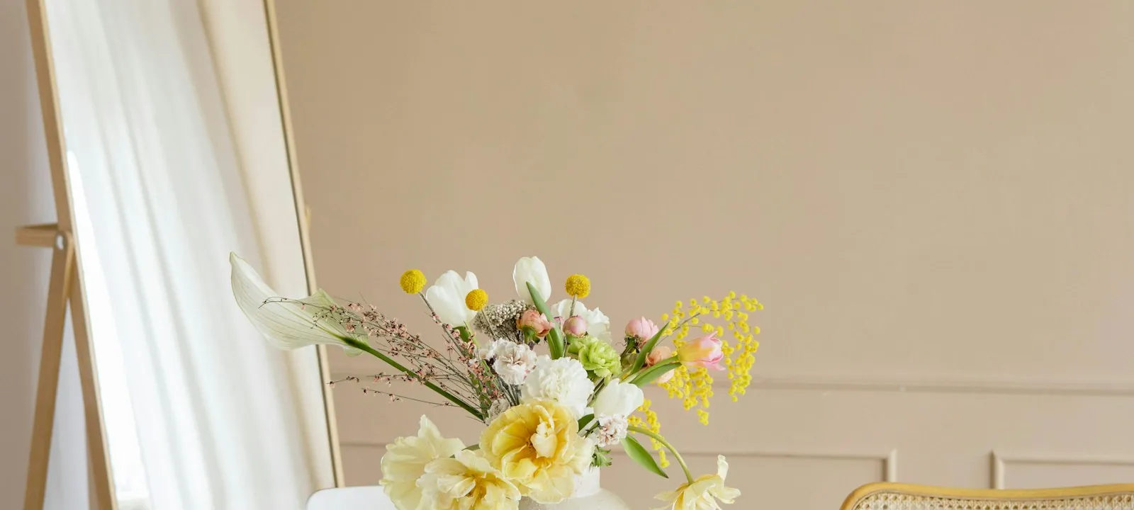 A bouquet of flowers in a bright, quiet interior