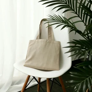 Waxed canvas weekend duffel with leather base corners