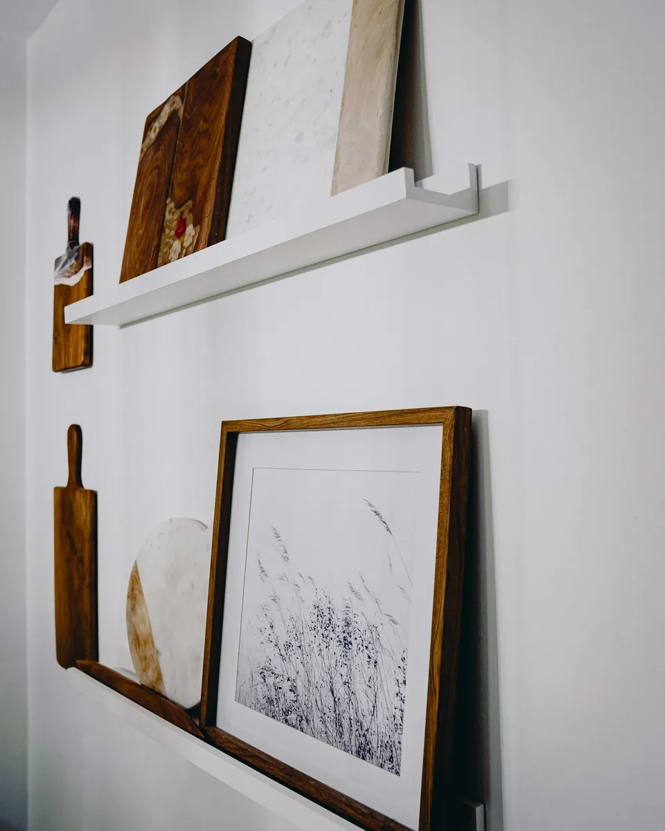 Two striped cotton tea towels on a rail