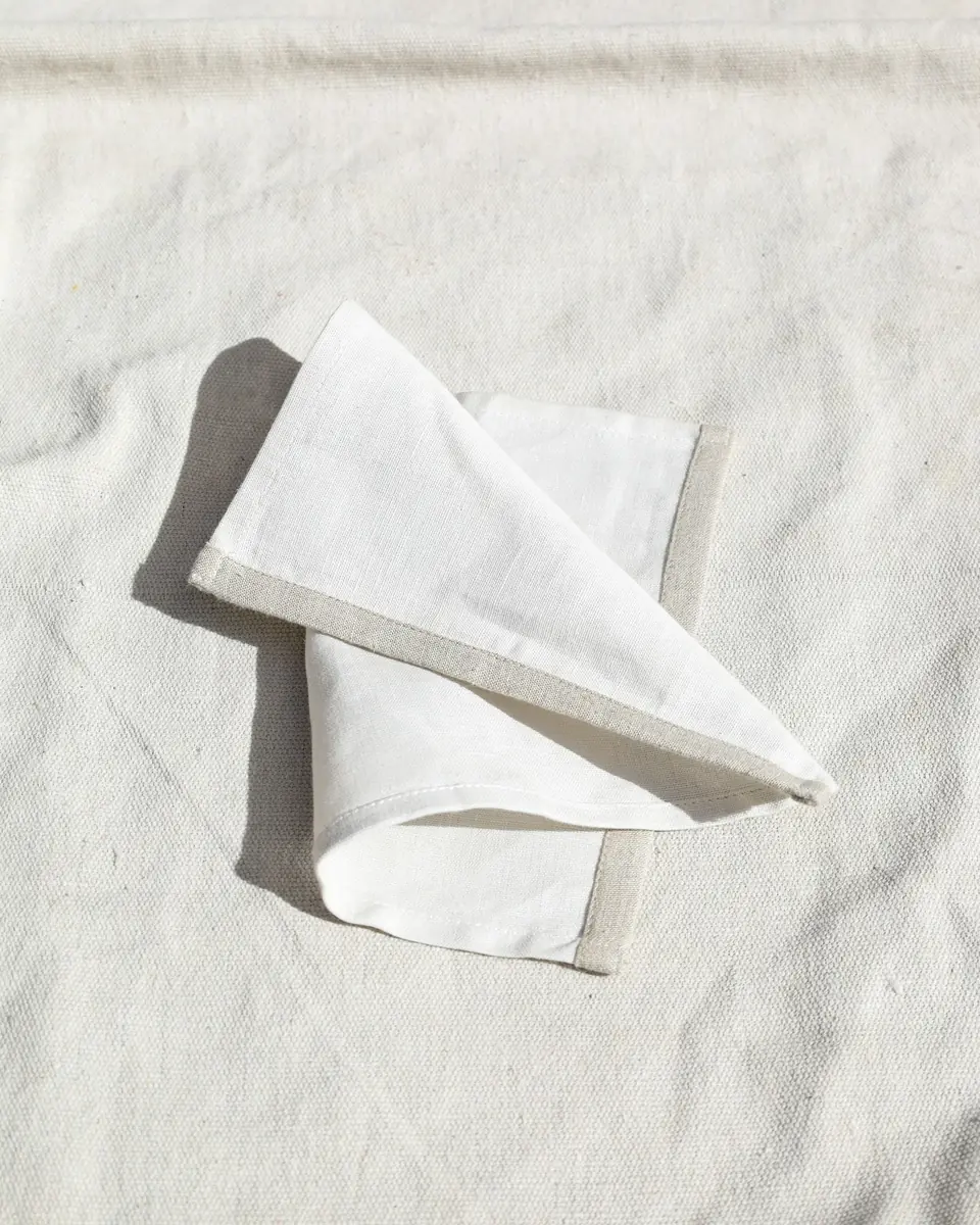 Striped linen table runner with hand-knotted fringe